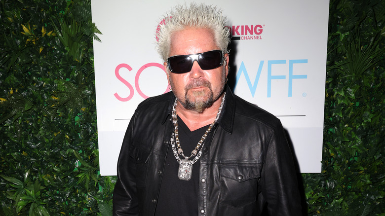 Guy Fieri posing at an event