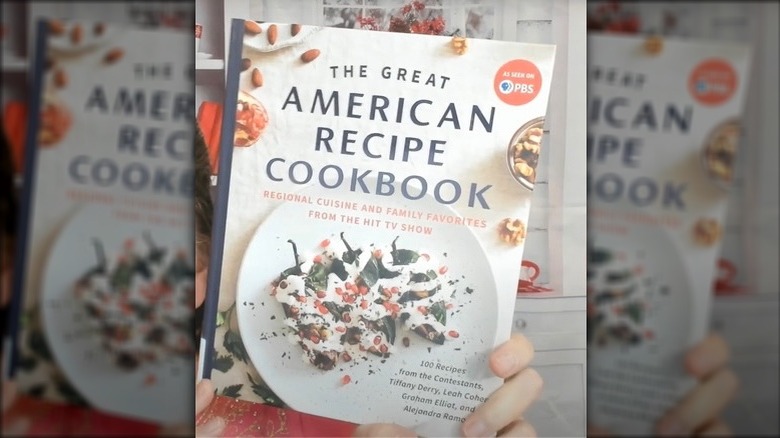 woman with Great American Recipe book