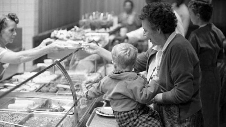 Woman and baby at Morrison's cafeteria line
