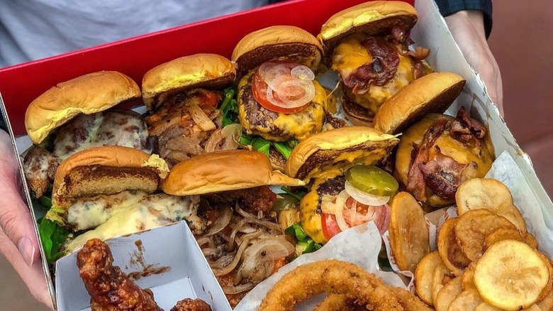 A box of mini burgers and sides from BurgerIM