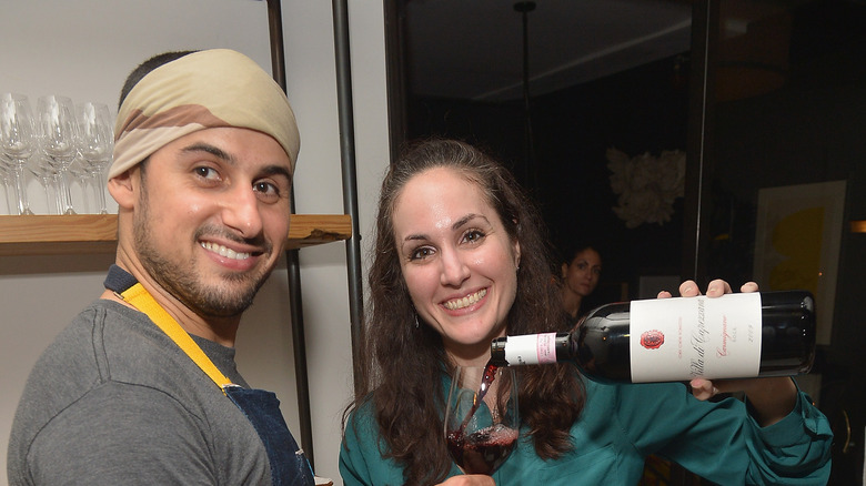  Ori Menashe and Genevieve Gergis share a glass of wine