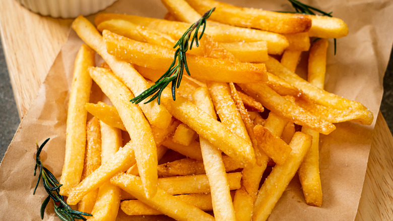 french fries on brown paper