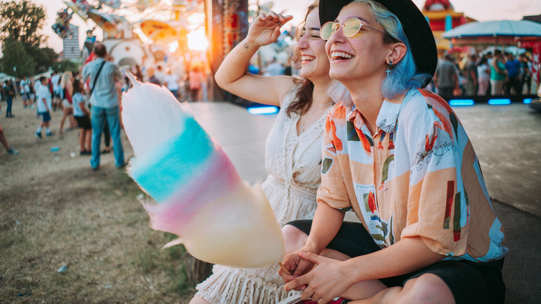 Fair patrons with cotton candy