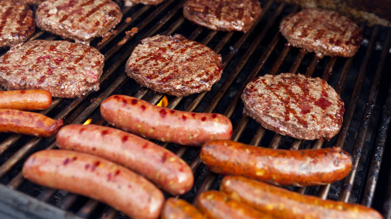 hot dogs and burgers on grill