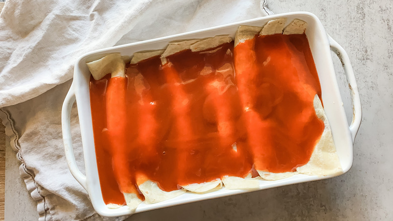 Rolled enchiladas coated in sauce