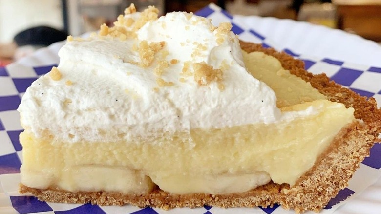 banana cream pie on blue and white paper