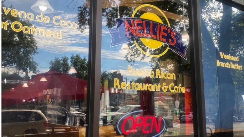 glass window and open sign for Nellie's