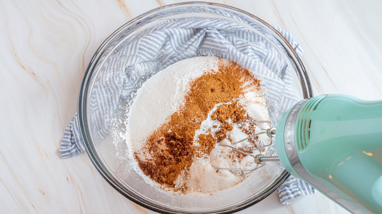 hand mixer blending dry ingredients