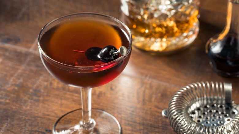 Manhattan cocktail served with cherries