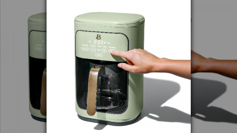 pistachio green Beautiful coffee maker on a white background