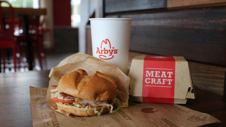 Arby's sandwich and drink on table