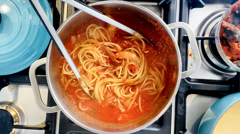 spaghetti, shrimp, and scallops in sauce