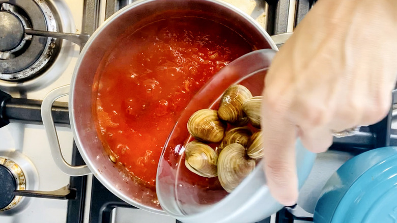 clams poured into tomato sauce