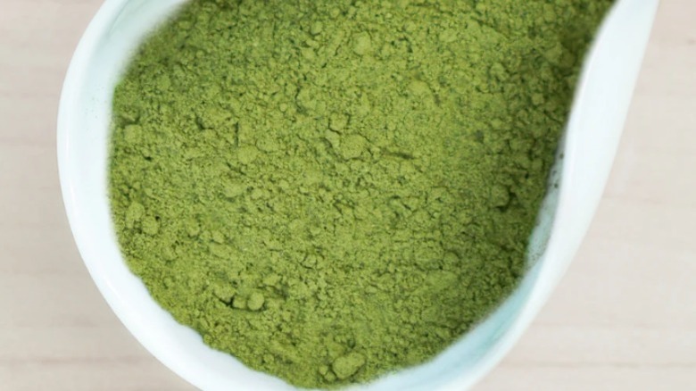 matcha powder in white container 