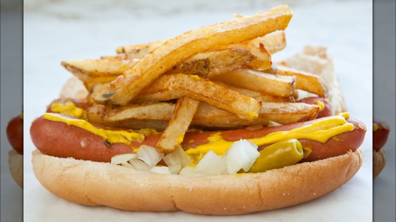 Mustard hot dog with fries