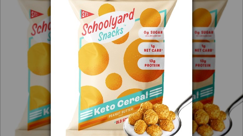 A bag of cereal with orange polka dots next to a spoonful of cereal