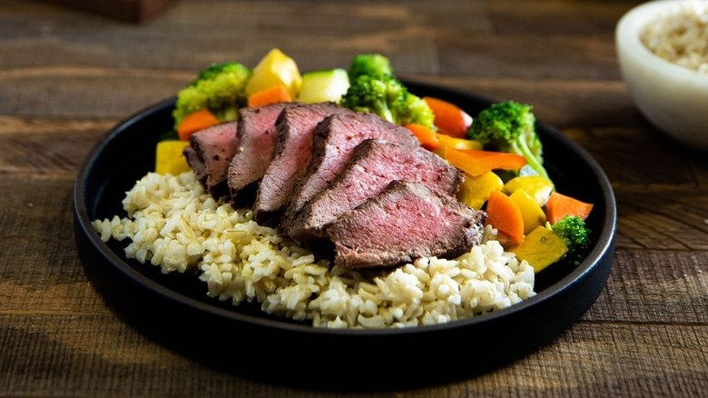 Steak, rice, and vegetables