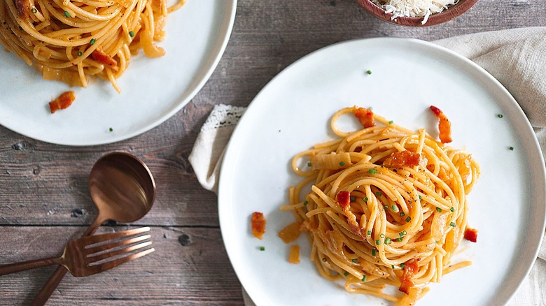 kimchi pasta sitting on plates