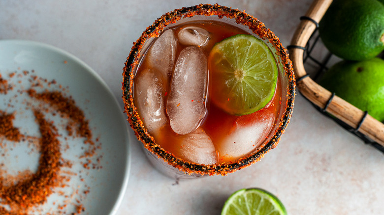 michelada in a glass with lime