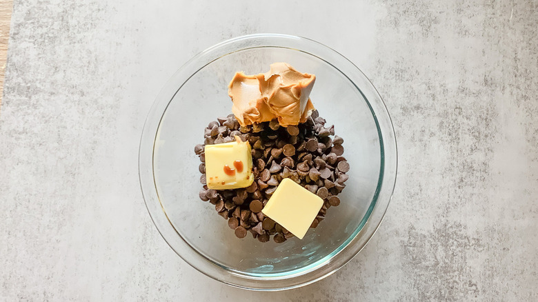 Bowl with chocolate chips, peanut butter, and butter