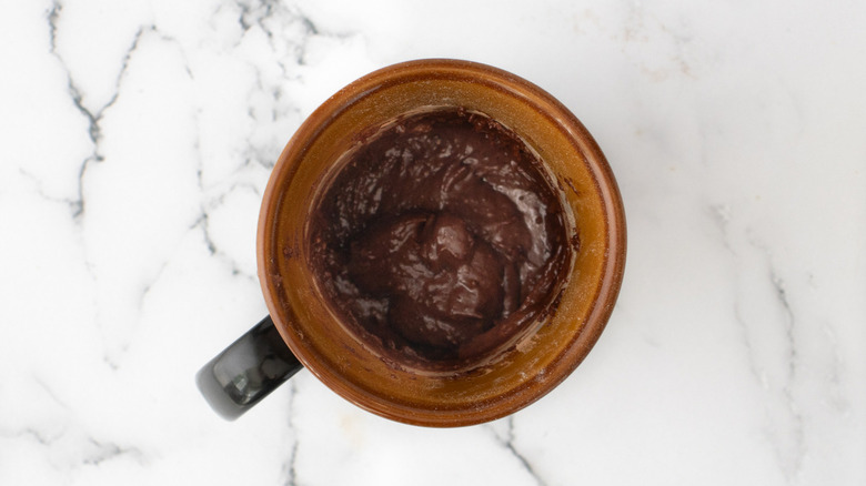 chocolate cake batter in mug