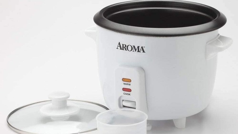 A white Aroma rice cooker on a white background