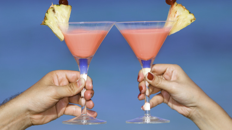 toasting pink martinis 