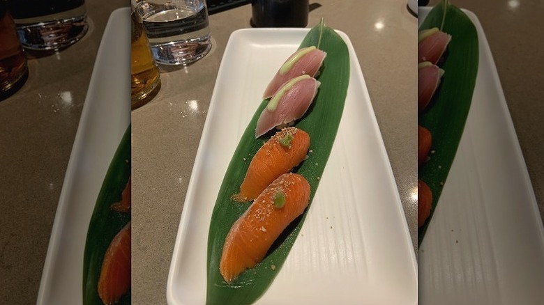 Rows of sushi on white plate