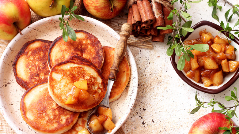 plate of pancakes with caramelized cinnamon apple topping