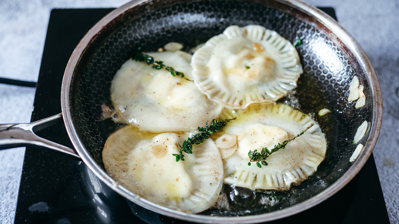 ravioli in pan with sauce