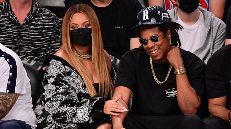 Beyoncé with Jay-Z at basketball game