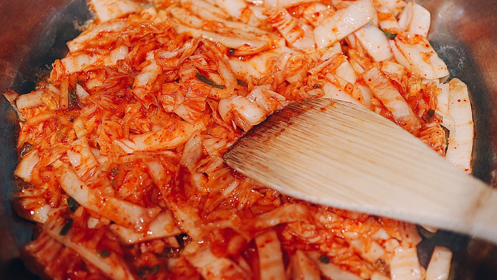 Kimchi sautéing in pan for bibimbap recipe