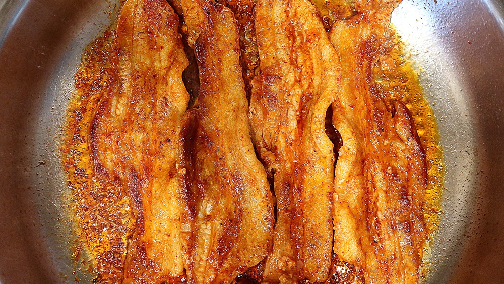 Marinated pork strips cooking in pan for bibimbap