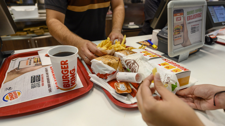 serving customer at Burger King 