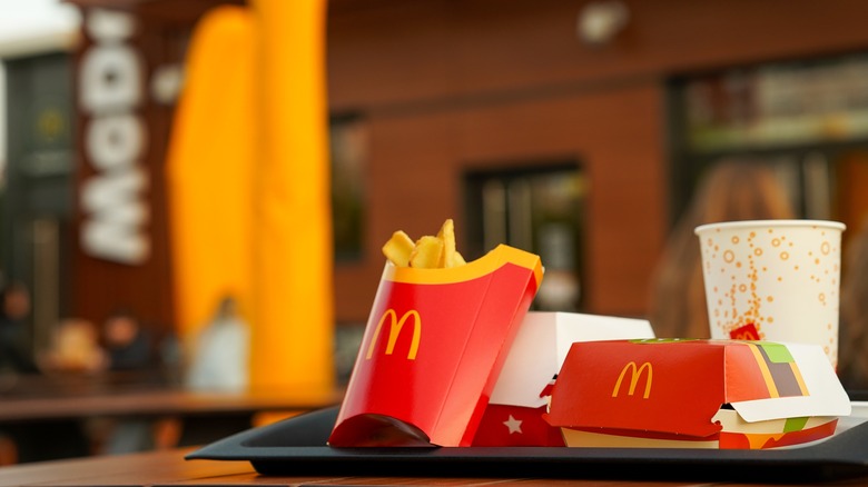 McDonald's fries, burger and drink tray on table