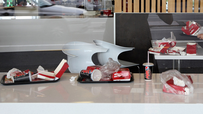 Used KFC packaging on restaurant tables