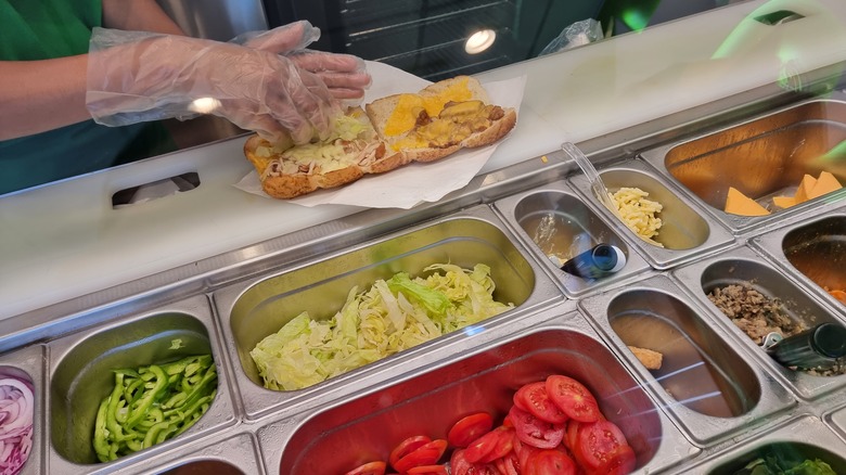 subway worker making sandwich