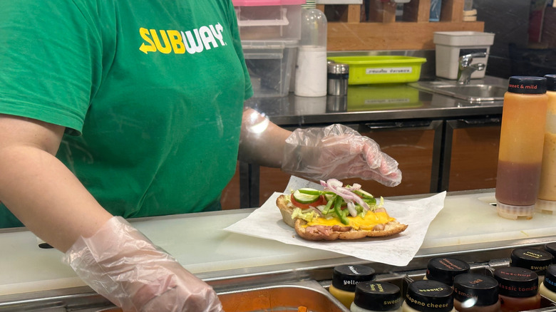 Subway employee making a sandwich