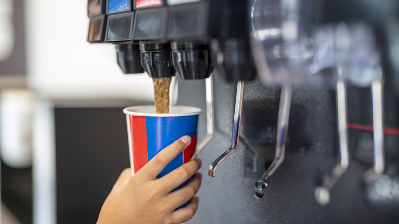 soda machine dispensing cola