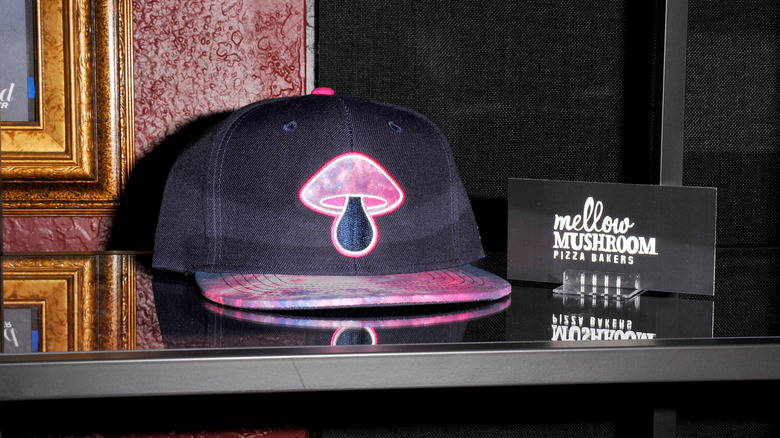 Mellow Mushroom black hat with pink mushroom patch