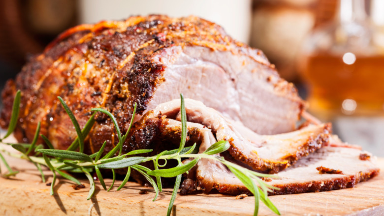 roasted pork shoulder on cutting board