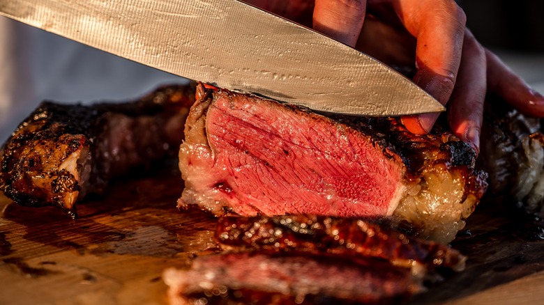 slicing steak against the grain