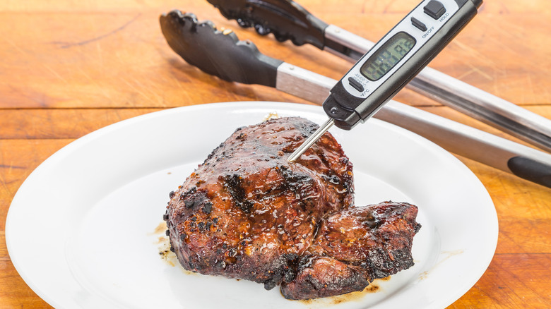 meat thermometer in steak