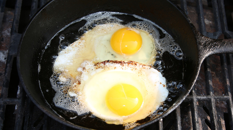 fried egg cooking in oil