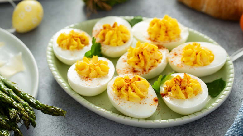 deviled eggs on a green plate