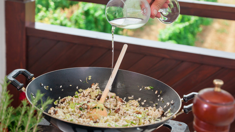 wine poured into wok