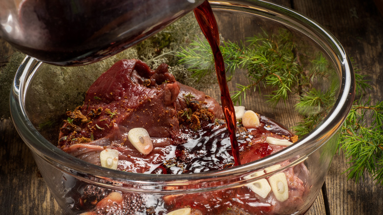 pouring wine into marinade