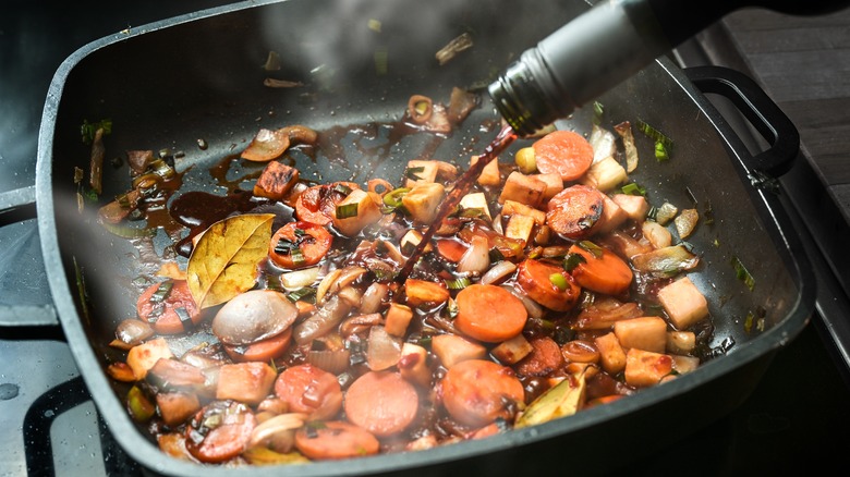 wine poured into pan to deglaze