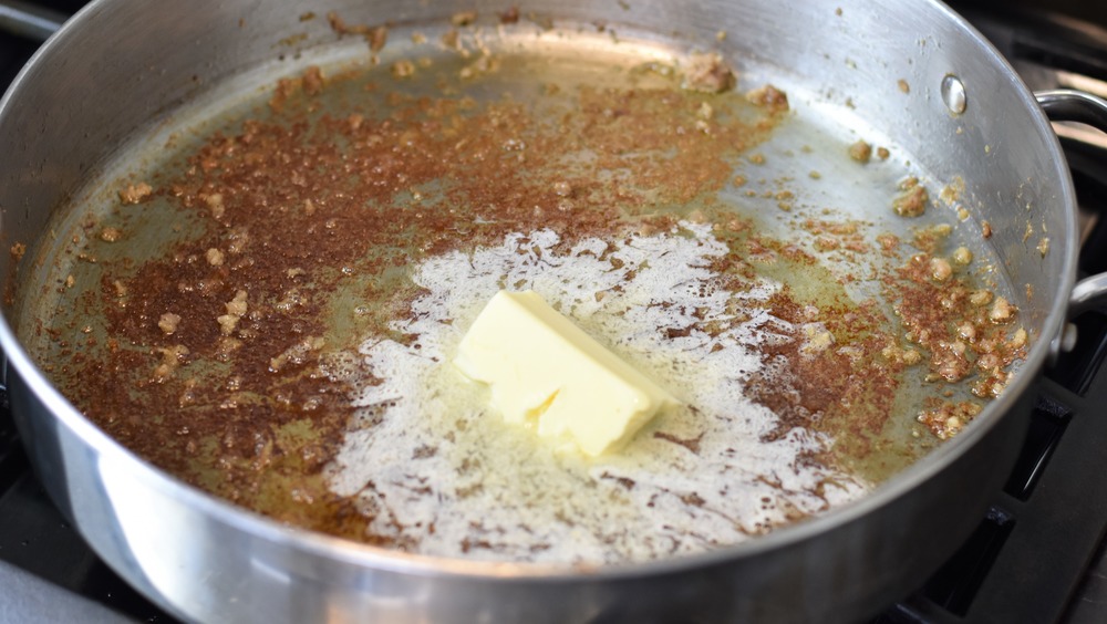 making gravy in a steel pan with butter