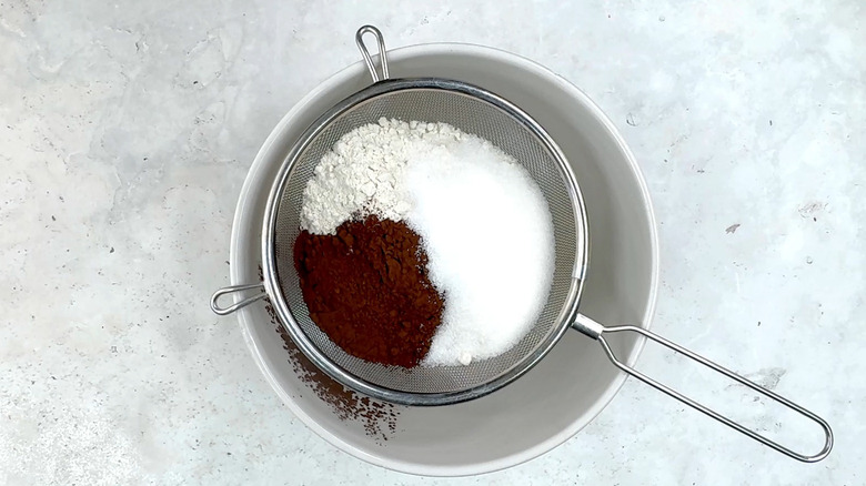 flour, cocoa powder, sugar and salt in sieve